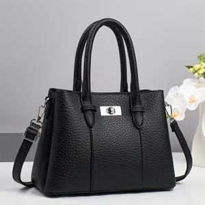 Classic black lychee pattern leather handbag with silver lock and detachable shoulder strap