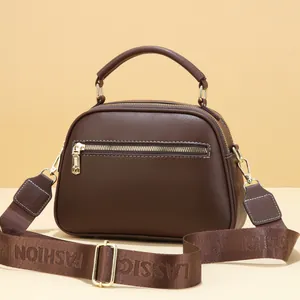 Women's dark brown leather handbag with fashion classic wide strap and gold hardware accents