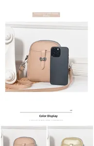 Litchi pattern leather phone crossbody bag with silver zipper and adjustable strap detail