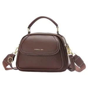 Brown lychee leather handbag with multi-layer design and top handle for women