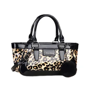 Retro leopard print patent leather tote bag with glossy black trim and plush ball charm