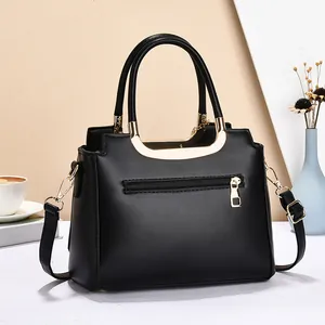 Classic black leather handbag for women with gold hardware and adjustable strap