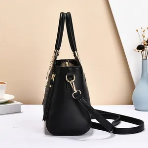 Elegant black faux leather tote bag for women featuring woven texture and pearl chain