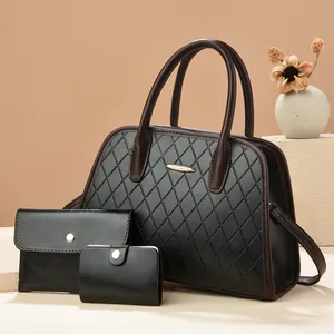Three-piece black quilted faux leather tote bag set with brown handles and gold hardware