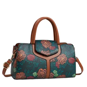 Borsa a bauletto con rilievo floreale blu navy e marrone con tracolla regolabile