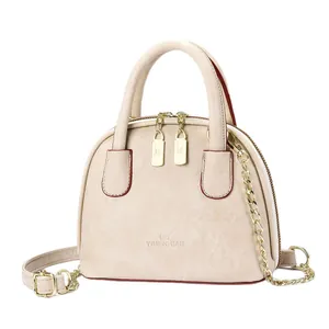 Minimalist beige shell bowling handbag in genuine leather with gold chain strap