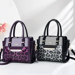 Minimalist leopard print tote bags in black and purple with gold chain strap