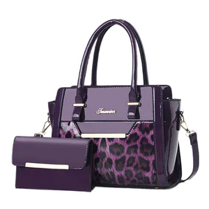 Purple leopard print tote bag set with matching wallet and gold hardware accents