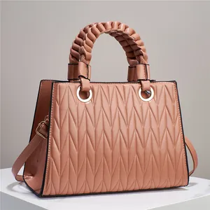 Elegant quilted faux leather handbag for women in light peach with braided top handle