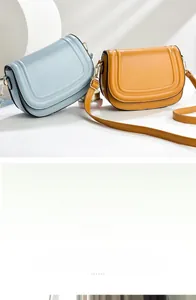 Close-up of saddle bags showing U-shaped 3D stitching detail and adjustable leather straps