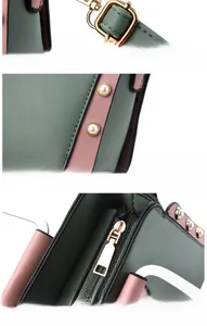 Detail of green and pink contrast handbag with pearl rivets and gold-tone hardware