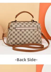 Detailed back view of a brown checkered satchel bag with golden zipper and textured leather
