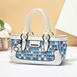 Blue and white checkered shell handbag with round handles and adjustable strap