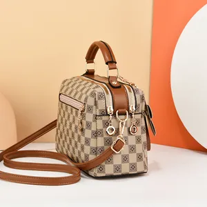 Retro checkered boston bag with floral pattern and brown leather handles for women