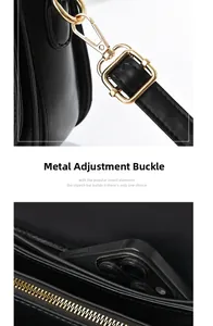 Detail of black leather saddle bag with gold metal hardware and interior compartments