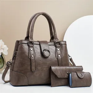 Three-piece vintage brown PU leather tote bag set with shoulder strap and small pouches