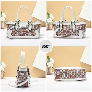 Detail view of white checkered handbag with dual handles and adjustable shoulder strap