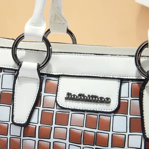 Detail of checkered shoulder bag featuring embossed texture and JinShimao metal logo