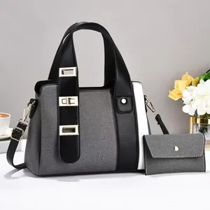 Sac à main bicolore en patchwork avec détails dorés et petite pochette assortie
