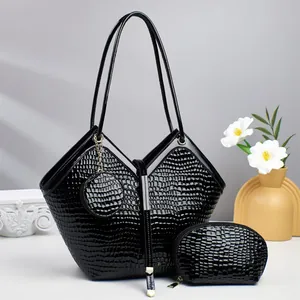 Three-piece black crocodile pattern tote bag set with glossy finish and modern V-fold design