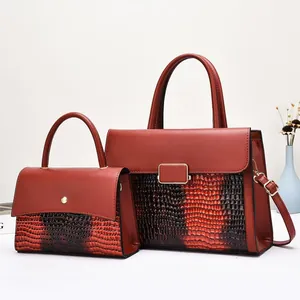 Two-piece dark red tote bag set with crocodile embossed texture and metal hardware