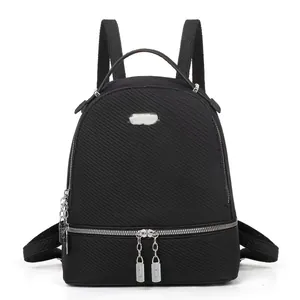 Black large capacity travel backpack for women with waterproof twill fabric and silver zippers