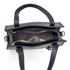 Top view of black pebbled leather tote bag showing spacious triple compartments