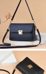 Détails du cuir grainé et du fermoir doré sur des sacs à bandoulière bleu et noir
