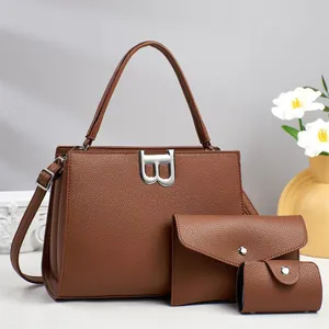 Three-piece brown pebble leather handbag set with silver B-shaped buckle and envelope pouch