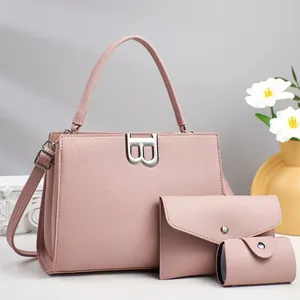 Three-piece pink lychee leather handbag set with metal B lock and matching wallets