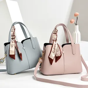 Elegant large capacity pebbled leather tote bags in blue and pink with silk scarf detail