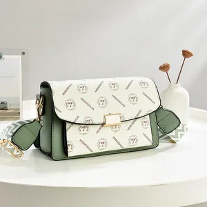 Green leather and printed pattern crossbody bag with adjustable wide shoulder strap
