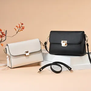 Sacs bandoulière minimalistes beige et noir avec texture litchi et fermoir doré chic