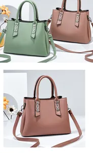 Close-up of contrast color leather handbags with silver hardware and adjustable straps