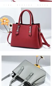 Detail of contrast color handbag showing silver chain buckle and premium faux leather texture