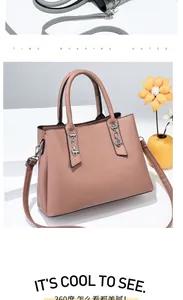 Detail of pink faux leather bag with lychee texture and silver metal hardware