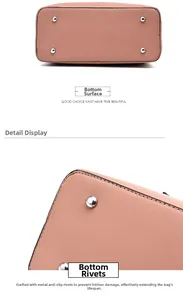 Detailed macro view of pink leather bag base with four silver protective metal rivets