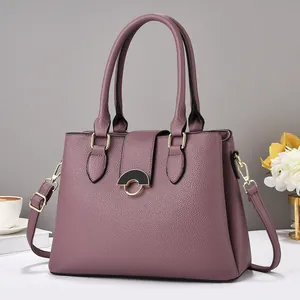 Elegant lavender luxury tote bag with lychee texture and gold hardware on white desk
