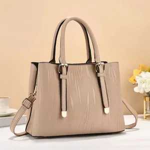 Minimalist beige striped bucket bag with top handles and adjustable shoulder strap