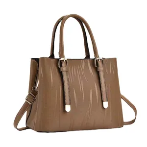 Brown striped bucket bag with gold hardware and adjustable strap for women
