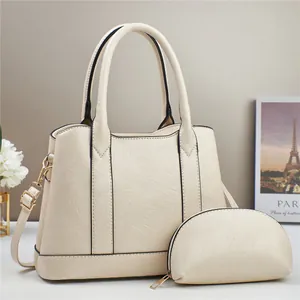 Large beige textured faux leather tote bag set with matching pouch and gold hardware