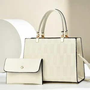 Elegant off-white embossed tote bag and matching clutch set with checkered pattern