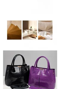 Detail of glossy crocodile embossed leather handbag and matching long wallet set
