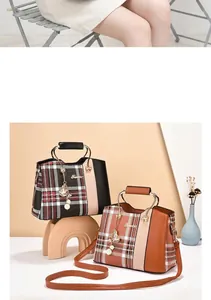 Close-up of plaid handbags with metal ring handles and stylish bell tassel details