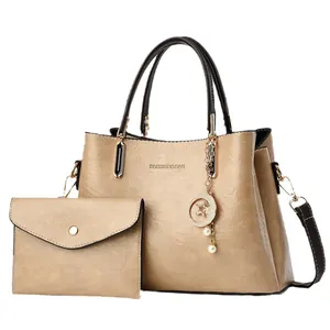 Fashion champagne gold tote bag set with matching envelope clutch and star pendant