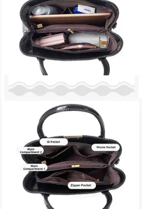 Detailed interior view of a large crocodile pattern handbag showing functional compartments