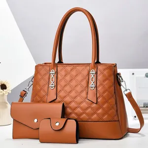 Three-piece set featuring quilted tote bag, envelope clutch and small wallet in tan PU leather