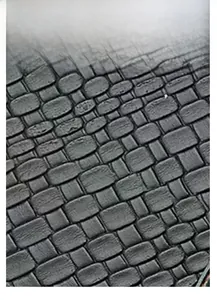 Macro shot of black crocodile texture faux leather material on a large handbag