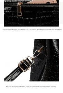 Detail view of black crocodile pattern leather with gold metal zipper and sturdy swivel clasp