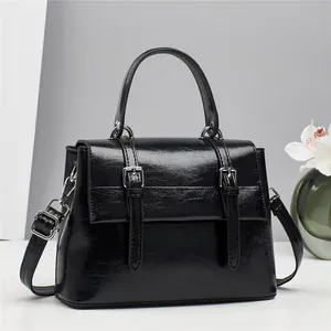 Vintage black faux leather briefcase tote bag with silver metal buckles and top handle